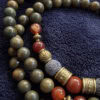 Elegant handmade beaded necklace with natural stones and brass accents. Perfect for stylish accessor.