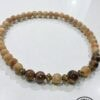 Handmade wooden beaded necklace with natural and dark brown beads, crafted in Canada.