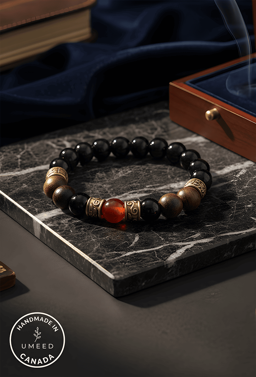 Elegant beaded bracelet featuring black, gold, and red beads, handcrafted by Umeed Designs.