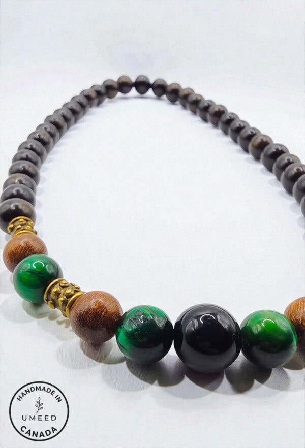Handcrafted beaded jewelry with wooden and gemstone elements.
