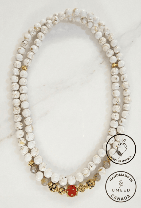 Pearl necklace featuring white pearls and gold accents, handmade by Umeed Designs in Canada.