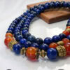 Handmade blue and orange beaded necklace with gold accents, crafted in Canada.