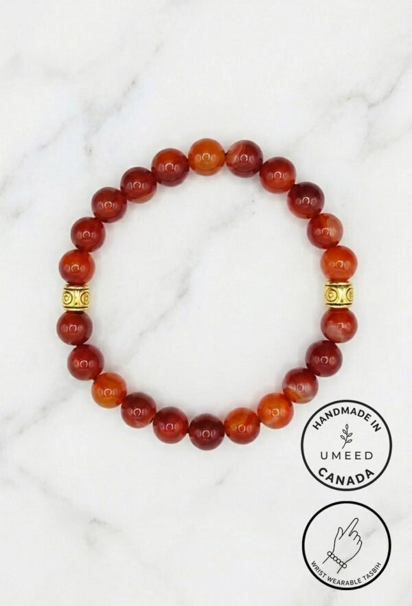 Red beaded bracelet with gold accents, handcrafted in Canada by Umeed Designs.