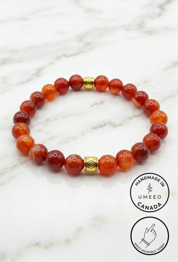 Red beaded bracelet with gold accents, handmade jewelry from Umeed Designs.