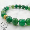 Elegant green beaded bracelet with a gold charm, handmade in Canada by Umeed Designs.