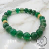 Green beaded bracelet with gold accents, handcrafted jewelry from Umeed Designs.