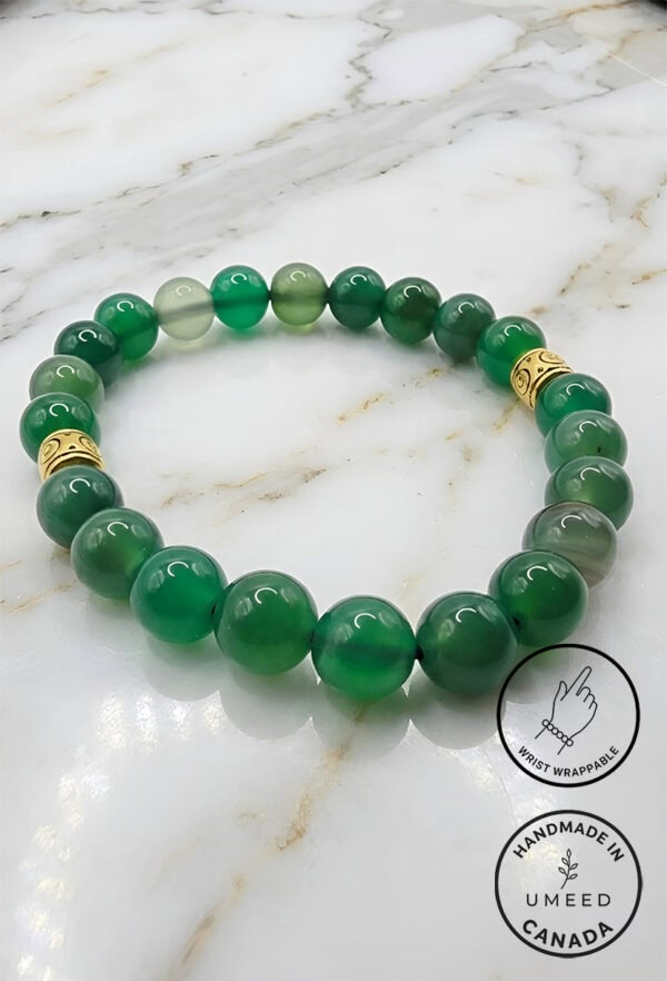 Green beaded bracelet with gold accents, handcrafted jewelry from Umeed Designs.