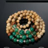 Bracelet jewelry made with natural wood and green beads, showcasing handcrafted craftsmanship.