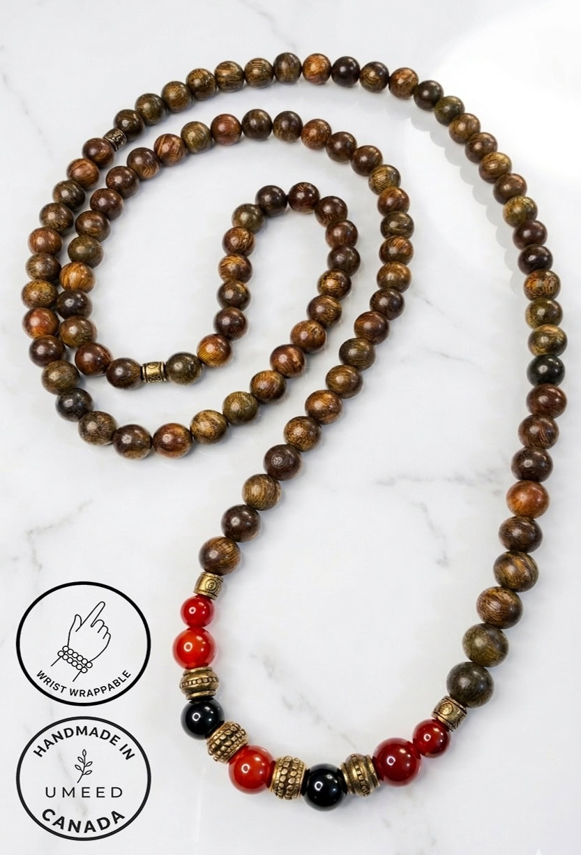Handmade wooden and beaded necklace with red and black accents, crafted in Canada.