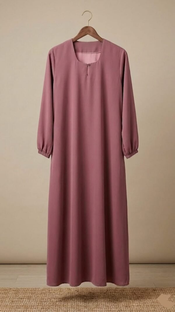 Long pink abaya with modest design and full-length coverage.