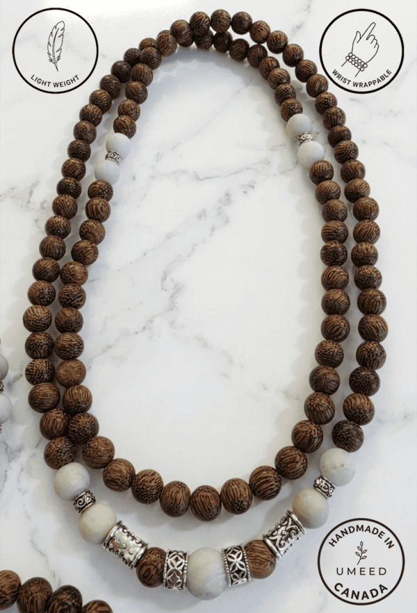 Wooden beaded necklace with white and silver accents.