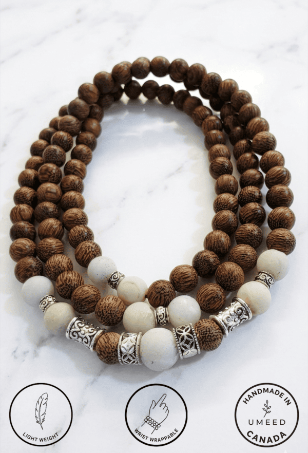 Wooden beaded necklace with white and silver beads, handcrafted in Canada, lightweight and stylish a.