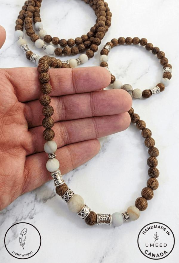 Elegant beaded jewelry with white and brown stones.