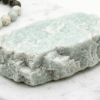 Natural green marble stone with a rough texture, ideal for jewelry making and home decor accents.