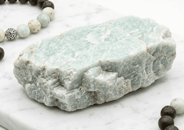 Natural green marble stone with a rough texture, ideal for jewelry making and home decor accents.