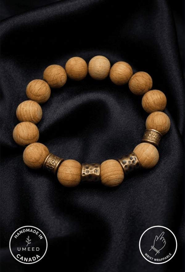 Bracelet featuring natural wooden beads and metal accents, handcrafted by Umeed Designs.