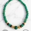 Green beaded necklace with gold and black accents, handmade jewelry from Umeed Designs.