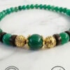 Handmade green beaded necklace with gold accents, crafted in Canada.
