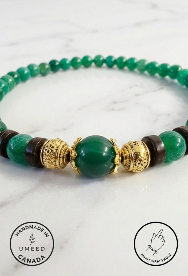 Handmade green beaded necklace with gold accents, crafted in Canada.