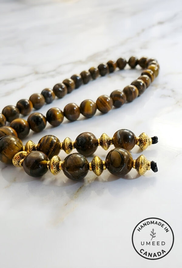 Elegant handcrafted tiger's eye beaded necklace with gold accents, made in Canada.