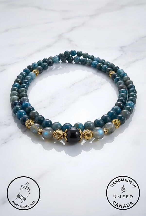 Blue and black beaded bracelet with gold accents, handmade jewelry from Umeed Designs.