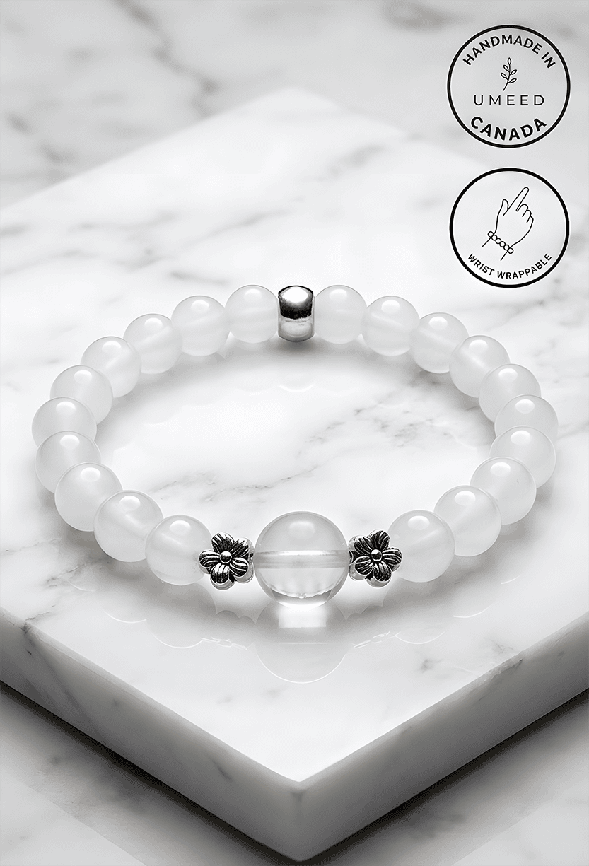 Elegant white beaded bracelet with floral accents, handmade in Canada.