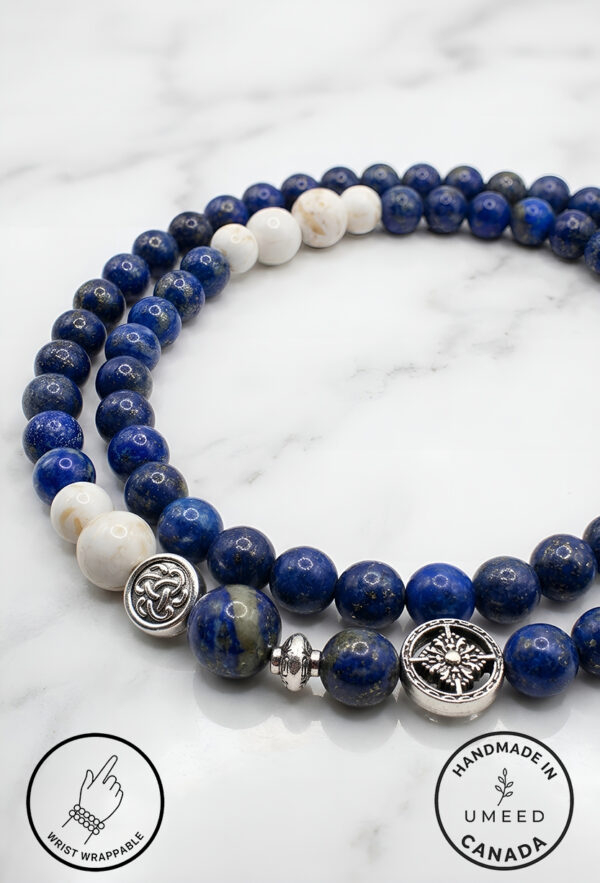 Elegant blue and white beaded bracelet with silver charms from Umeed Designs.