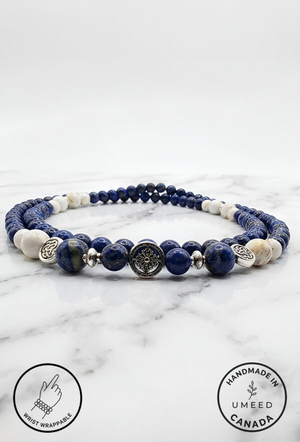 Handmade blue and white beaded bracelet with silver accents from Umeed Designs.
