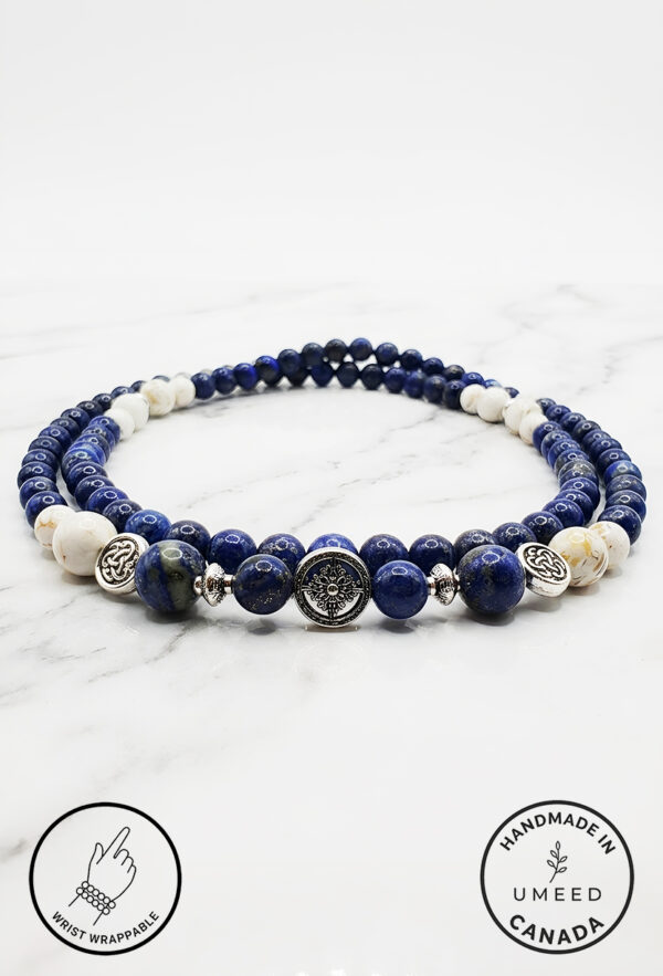 Elegant blue and white beaded necklace with silver accents from Umeed Designs.