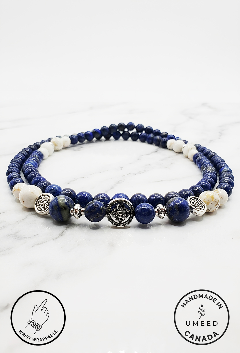 Elegant blue and white beaded necklace with silver accents from Umeed Designs.