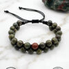Handmade green and brown beaded bracelet with adjustable cord from Umeed Designs.