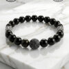 Black beaded bracelet with lava stone and silver accents, handmade in Canada by Umeed Designs.