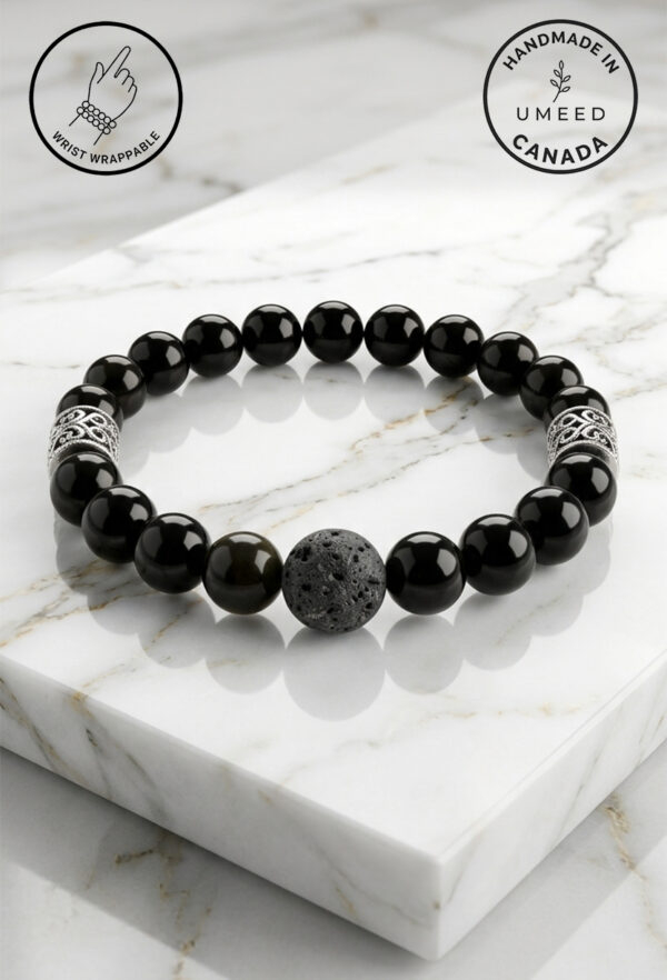 Black beaded bracelet with lava stone and silver accents, handmade in Canada by Umeed Designs.