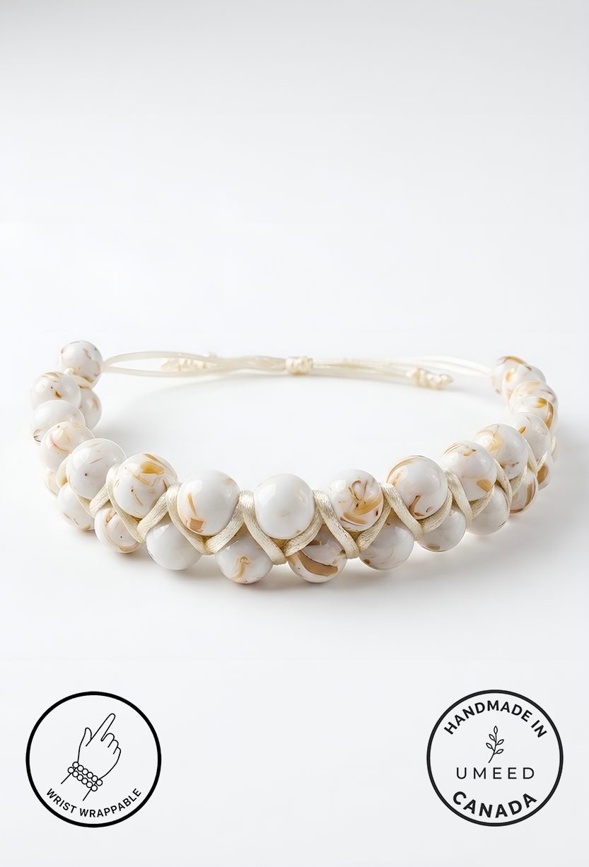 Elegant handmade white pearl necklace with gold accents from Umeed Designs.