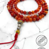 Handmade red and orange beaded mala with silver accents and red tassel.