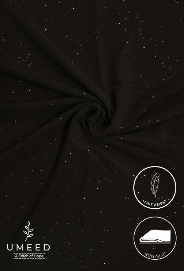Black fabric with gold specks, lightweight and non-slip for elegant drapes.
