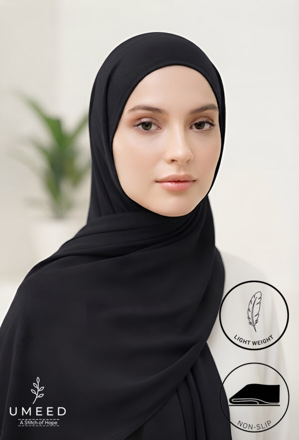 Elegant woman wearing a lightweight, non-slip black hijab from Umeed Designs.