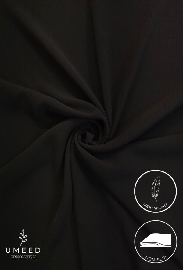 Black lightweight, non-slip fabric with a smooth texture for clothing or accessories.