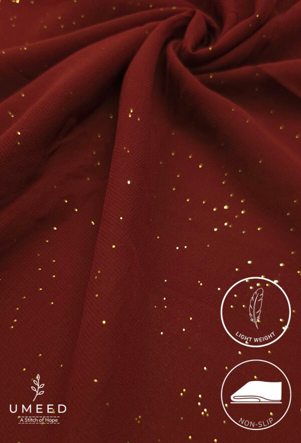 Red fabric with gold glitter accents, lightweight and non-slip for elegant clothing.