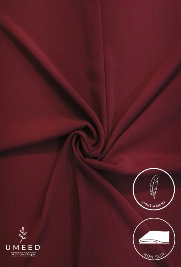 Maroon lightweight fabric with a smooth texture and elegant drape.