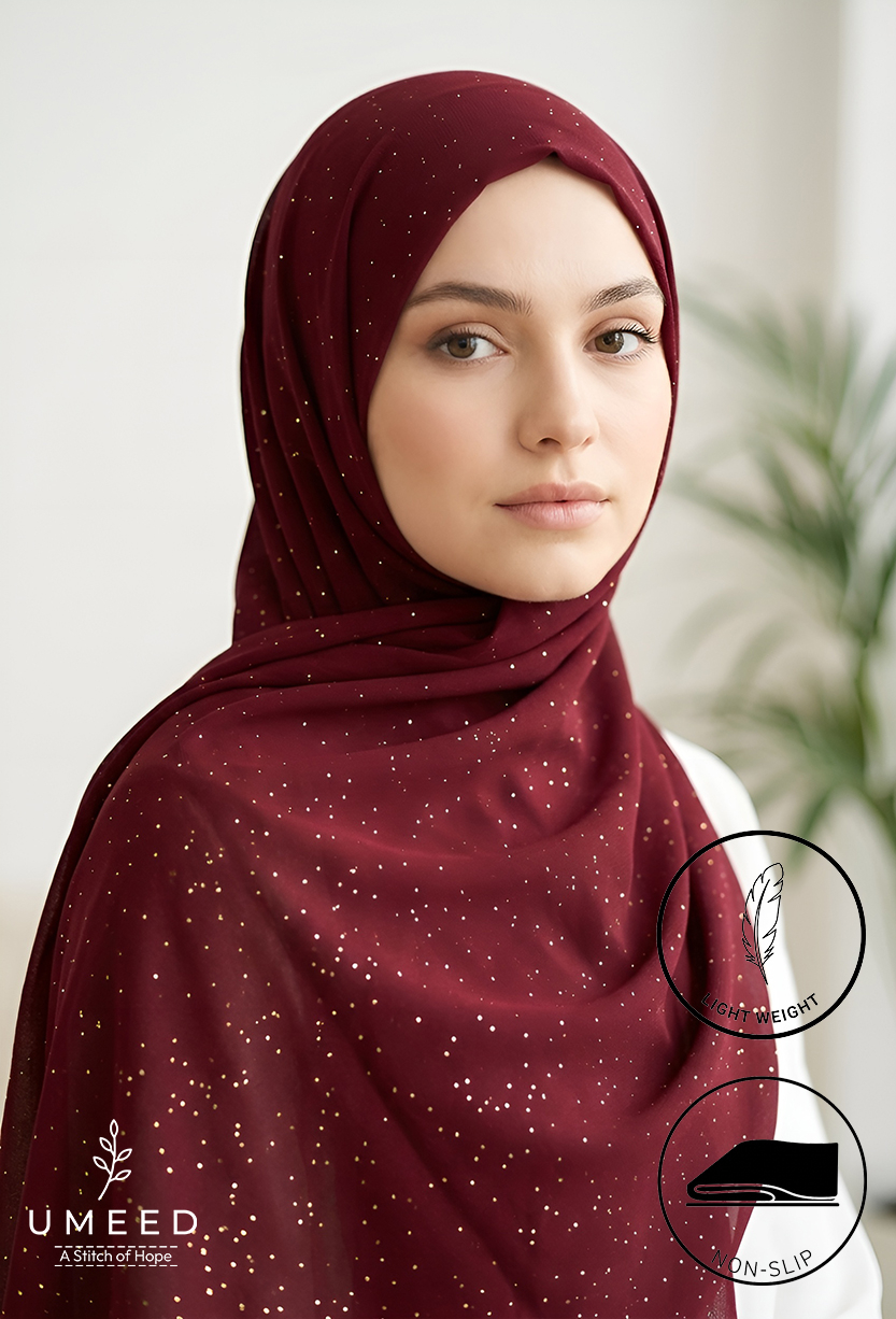 Beautiful woman wearing maroon hijab with gold accents for modest fashion.
