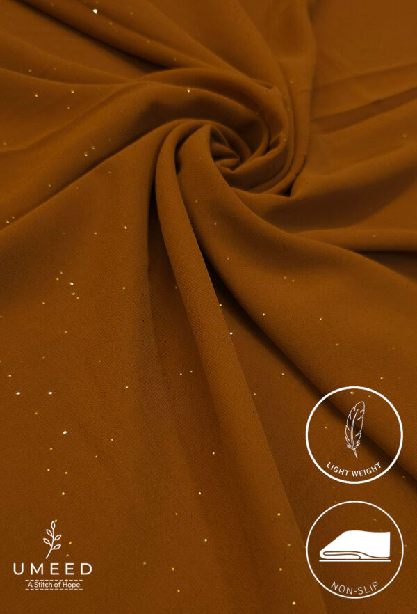 Lightweight, non-slip mustard-colored fabric with subtle glitter accents.