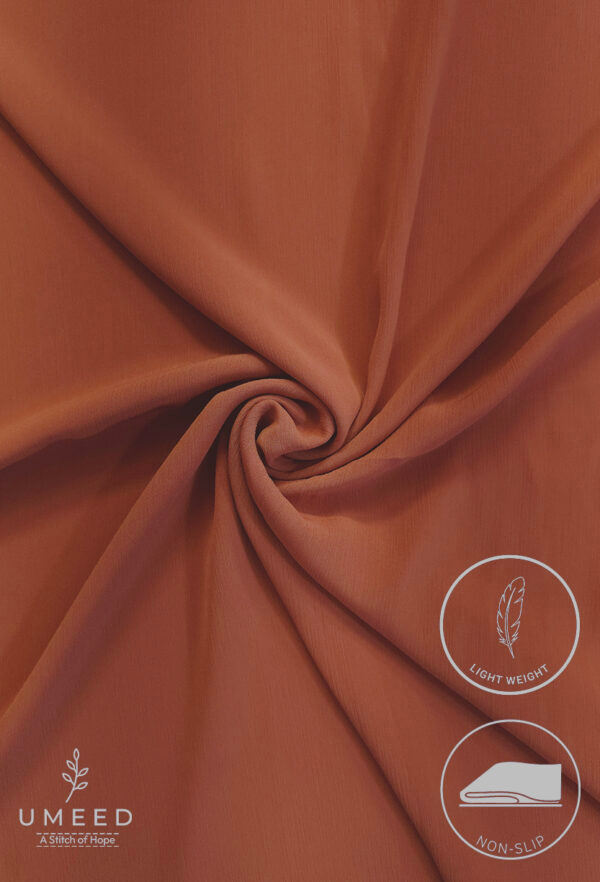 Lightweight, non-slip peach-colored fabric for upholstery or crafts.
