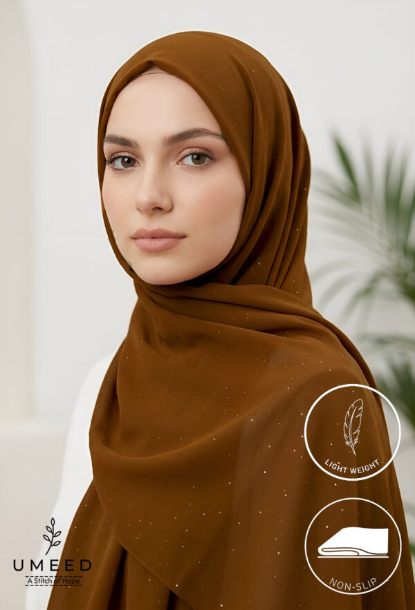 Elegant woman wearing a brown hijab with subtle embellishments for modest fashion.
