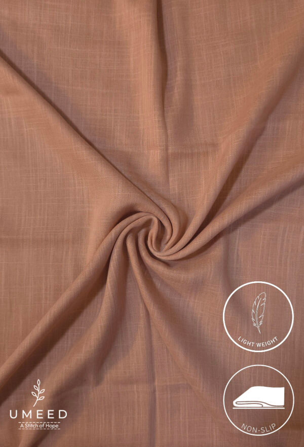 Lightweight, non-slip beige fabric for clothing or crafts.