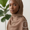 Elegant woman wearing a light weight, non-slip beige hijab from Umeed Designs.