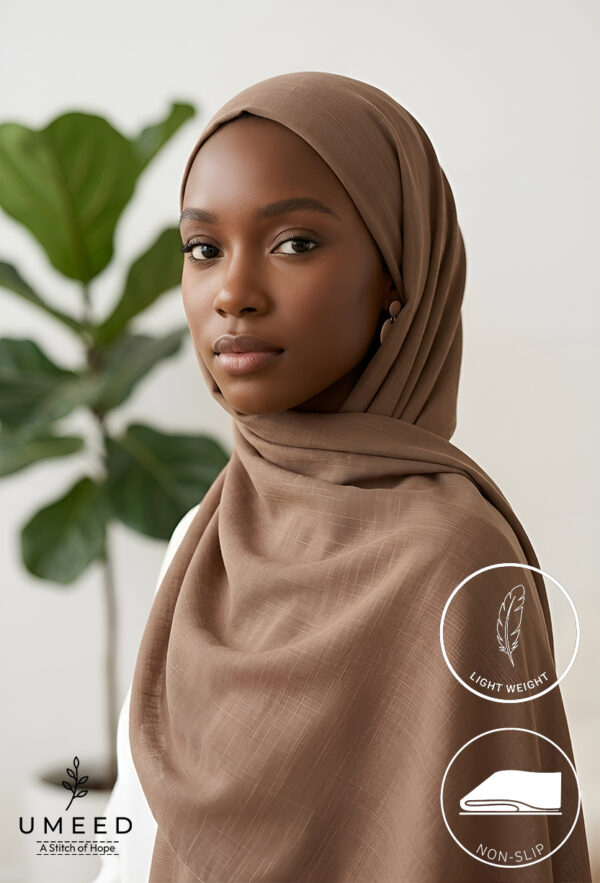 Elegant woman wearing a light weight, non-slip beige hijab from Umeed Designs.