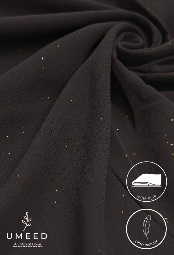 Black fabric with small gold specks, lightweight and non-slip for clothing or accessories.