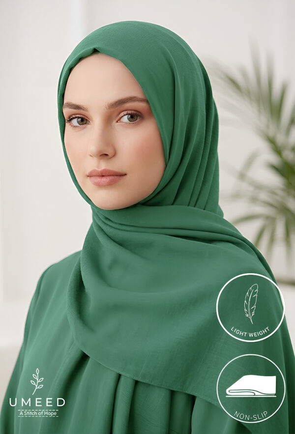 Elegant woman wearing a green hijab with a light weight and non-slip design.