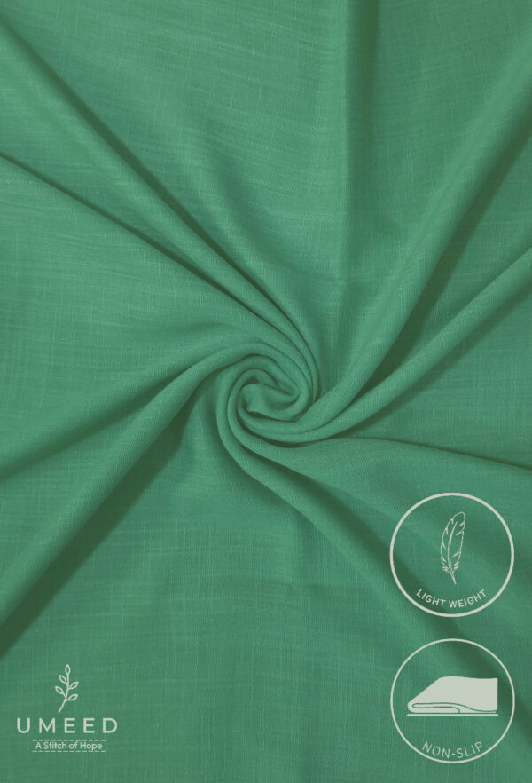 Lightweight, non-slip green fabric from Umeed Designs for comfortable wear.